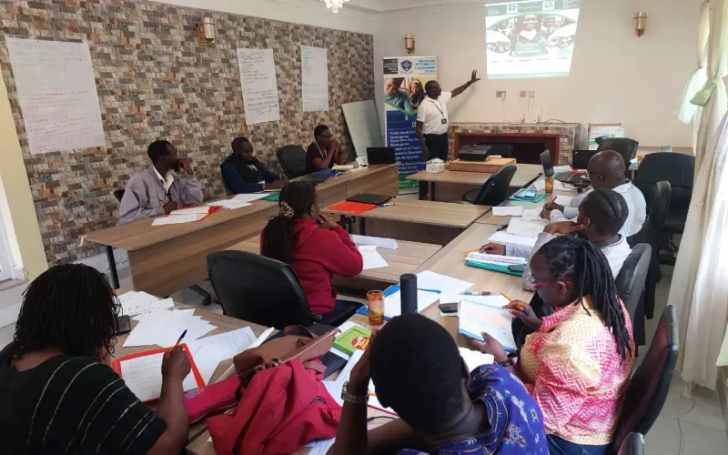 Students following a presentation in an IDIA College classroom