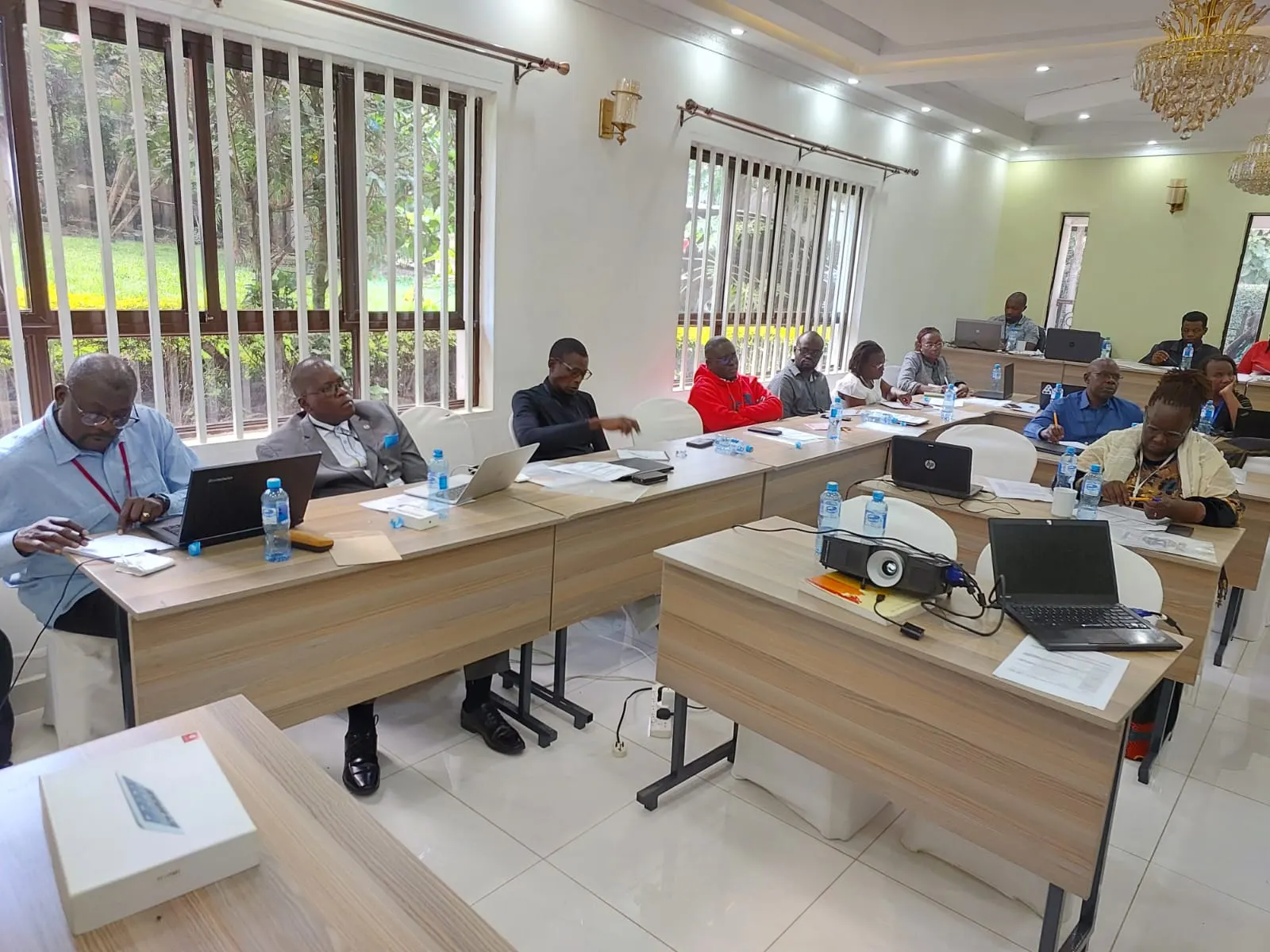 Participants working on laptops in a training room